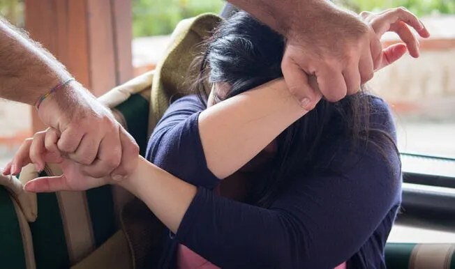 Attorney meeting with client about restraining order case in San Diego courthouse